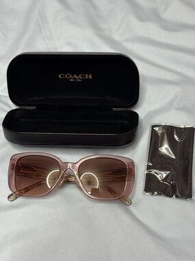 Coach Authentic HC8352 sunglasses with a transparent rose frame and floral print